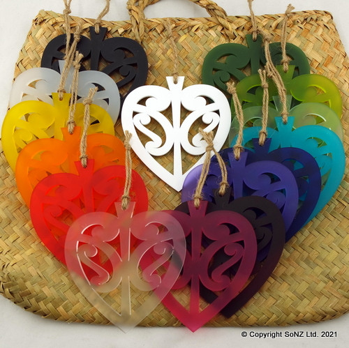 Heart-shaped acrylic wall hanging with cut-out kōwhaiwhai design
