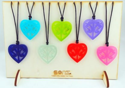 Acrylic heart necklace with cut-out kōwhaiwhai design