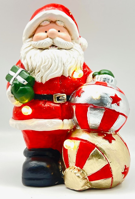 Standing santa figurine with baubles