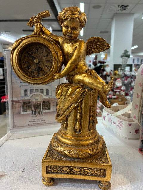 gold colour art deco style Cherub clock