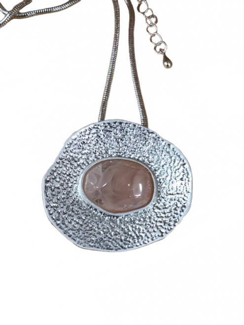 Silver coloured textured disc necklace with pale pink resin centre Silver coloured textured disc necklace with pale pink resin centre