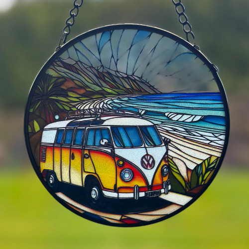 round hanging coloured glass Combi van at beach