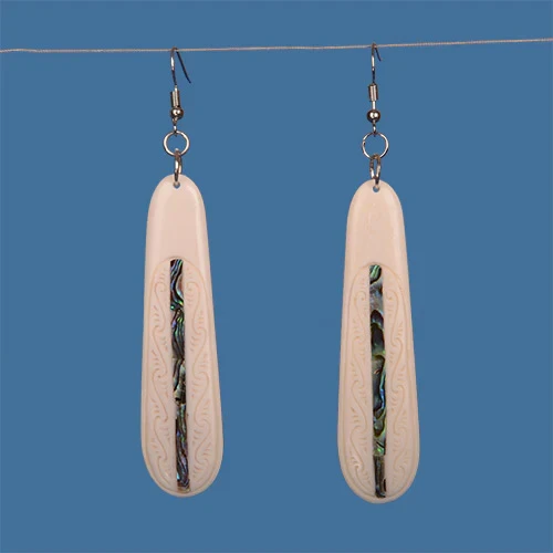 Long oval bone earrings with kowhaiwhai engraving and paua shell detail