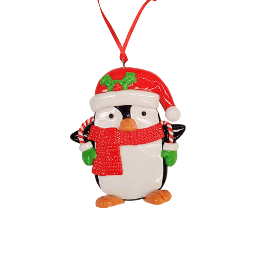 Hanging Christmas penguin ornament wearing a red Santa hat and scarf