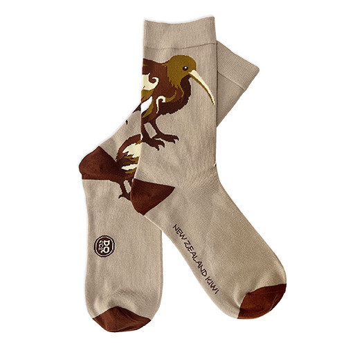 Pair of beige NZ souvenir socks with brown kiwi bird design and dark brown heels and toes