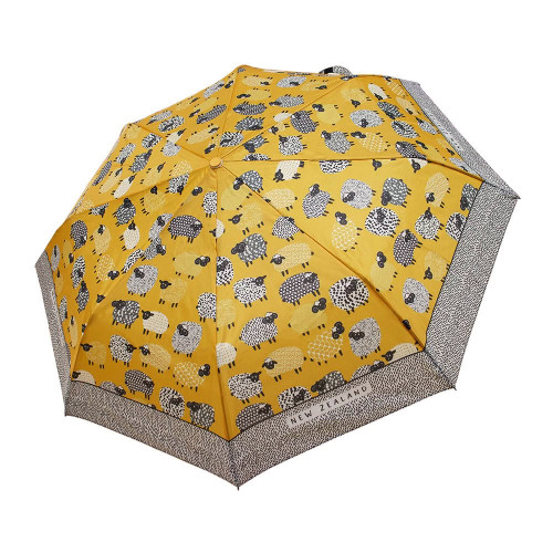 Open yellow NZ umbrella with sheep design on the canopy