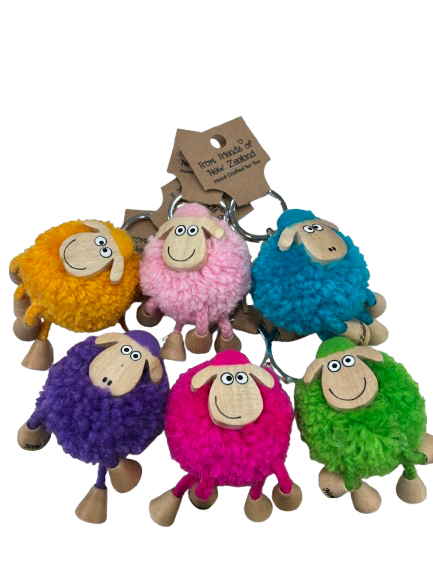 Group of six colourful New Zealand sheep pom-pom keyrings with wooden faces and dangly legs
