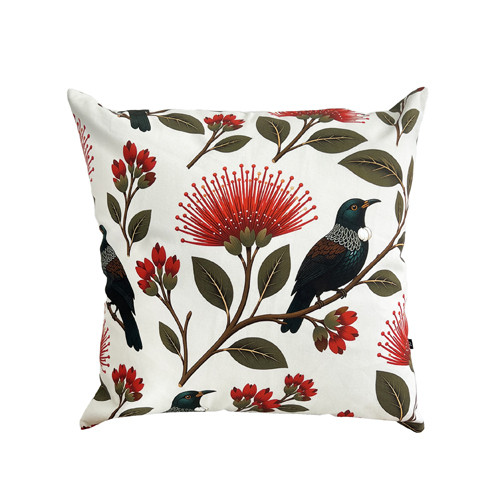 Cream cotton cushion cover with New Zealand tūī and pōhutukawa design