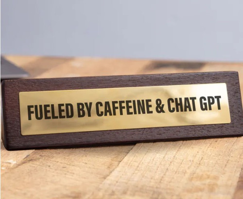 Novelty desktop sign with Fuelled by Caffeine and ChatGPT wording