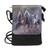 black shoulder bag with a print of a pair of horses on the front