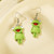 green frog earring on hook
