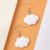 White Cloud earrings on hook