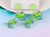 Cute Cartoon Dinosaur hung from Lime Green stud on posts””