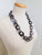 interlinked chunky chain resin necklace in shades of grey