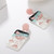 Pink Flamingo oblong acrylic scene hung from pink stud earrings on posts