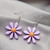 purple daisy with orange centre earrings on hooks