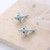 grey shark stud earrings on posts