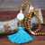 Long wood bead boho style pendant necklace with turquoise blue tassel and white round shape