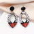 Tropical resort style pattern, acrylic drop earrings from round black stud on posts - black, red, lilac