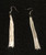 silver tassel earrings on hook