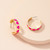 Gold colour C shape earrings with bright pink hearts
