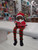 Santa hanging Kiwi ornament with New Zealand sign and dangling legs