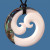 Hand carved bone and paua double koru pendant