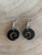 Koru black acrylic earrings on hook