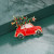 car with Christmas tree on roof pin