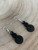 Small Pikorua twist black acrylic earrings