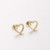Gold hollow heart earrings on stud