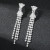 Silver plated tassel with rhinestone drop earrings from bow stud on posts