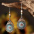 Boho style teardrop earrings with faux pearl and diamante detail on silver coloured  long hoops