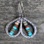Hammered metal hollow teardrop earrings with dangling beads on hooks