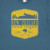 NZ Souvenir T Shirt - Slate Blue  with yellow badge with kiwi and mountain design and slogan Forever Adventure