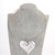 Silver coloured solid heart pendant on choker