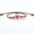 Bracelet with red dried flower in glass ball on brown cord