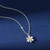 Silver coloured daisy pendant on chain necklace
