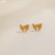 Cute bow earrings on studs -  gold coloured