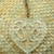 Heart-shaped acrylic wall hanging with cut-out kōwhaiwhai design