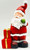 Standing santa with wrapped box