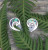 Sterling silver earrings in Koru shape with NZ paua shell inlay