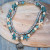 Two layer anklet with grey and turquoise beads, starfish and shell charm