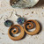NZ made green wooden koru earrings with NZ paua shell