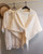 Women's warm knit cape with pull-through fastener | various colours