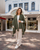 Women's warm textured knit cape with tassels olive, in front of Adore Collection, Napier