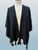 Women's warm textured knit cape with tassels black