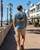 Light blue Napier NZ souvenir T-shirt with whale tail and waves design