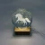 Unicorn etched into glass crystal ball on wooden LED lamp