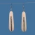 Long oval bone earrings with kowhaiwhai engraving and paua shell detail